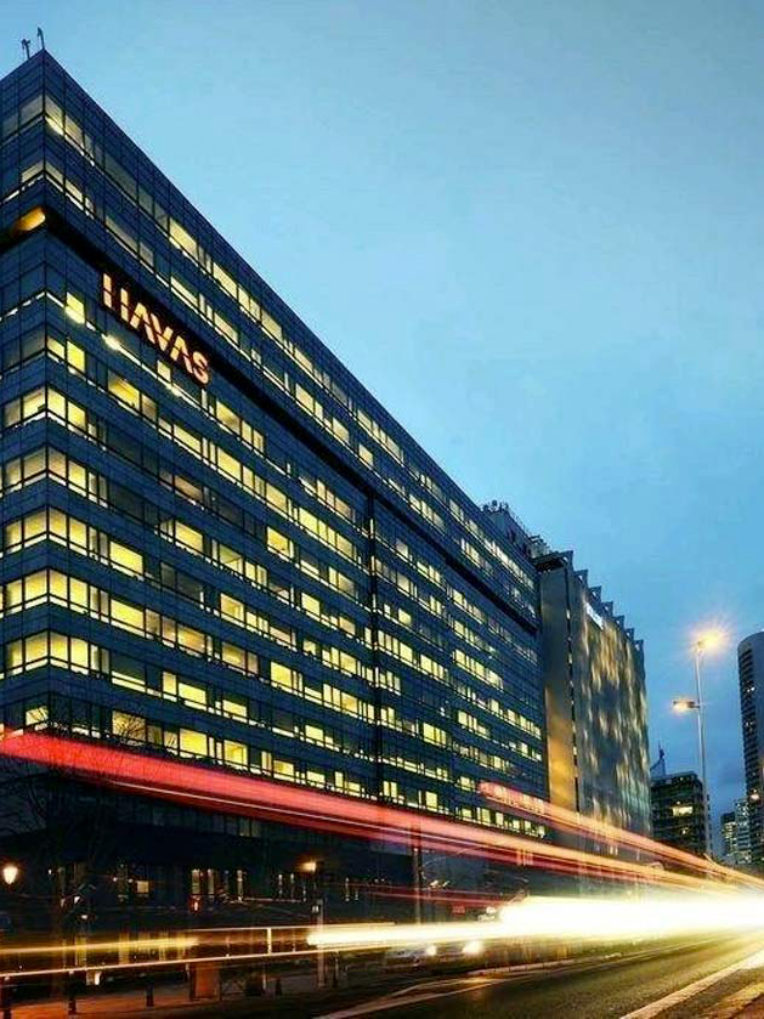 Havas headquarters facade lit at night